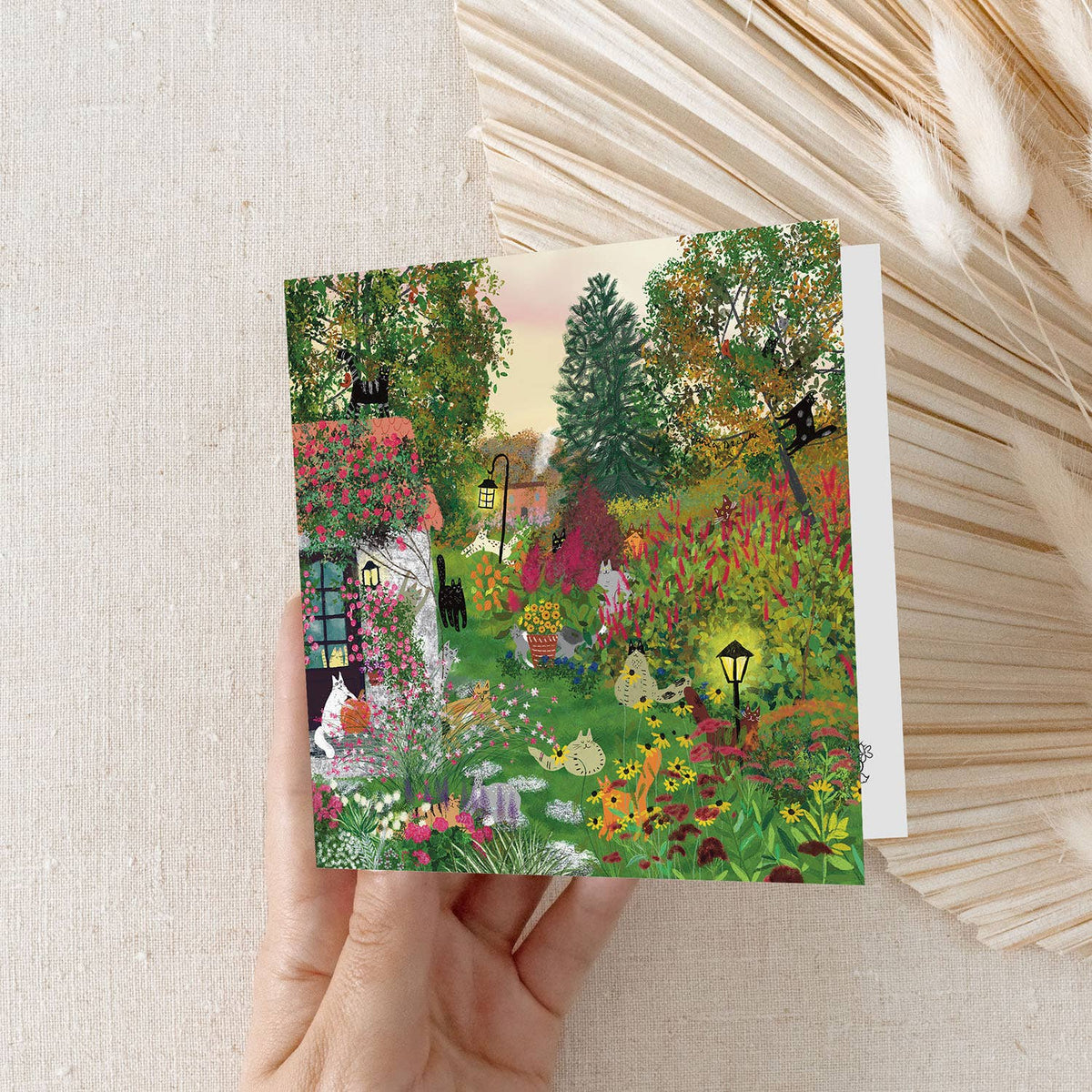 Cats in a fall garden: Greeting card