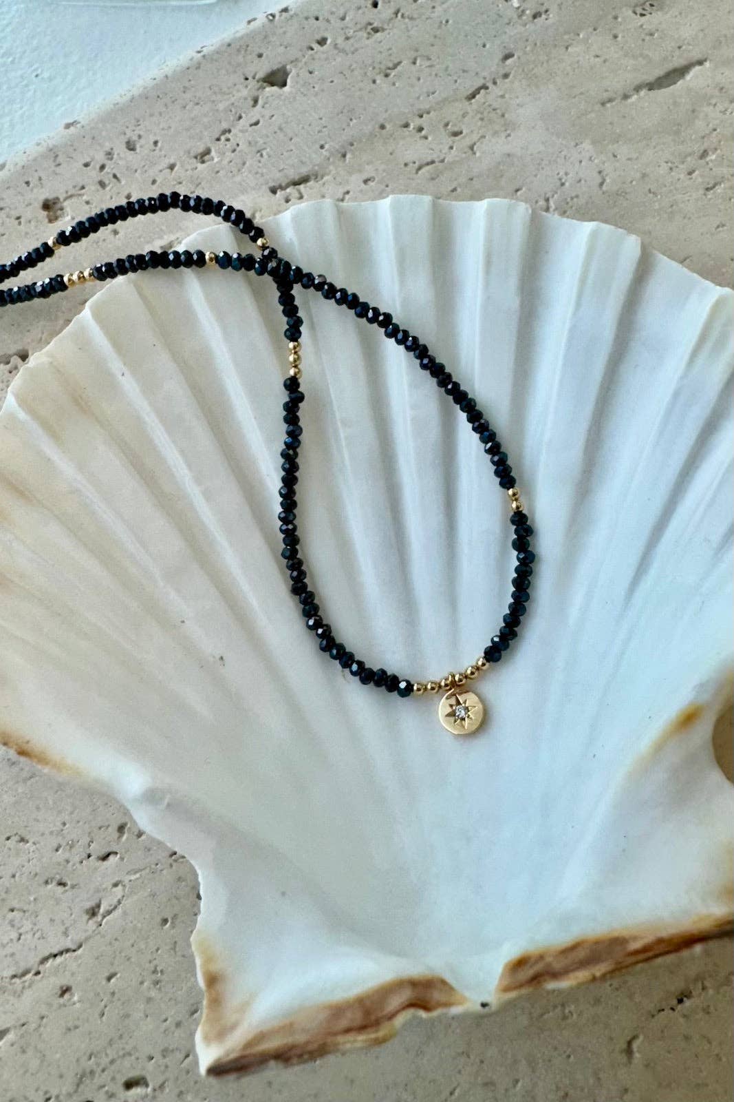 BEADED STAR MEDALLION NECKLACE: HEMATITE